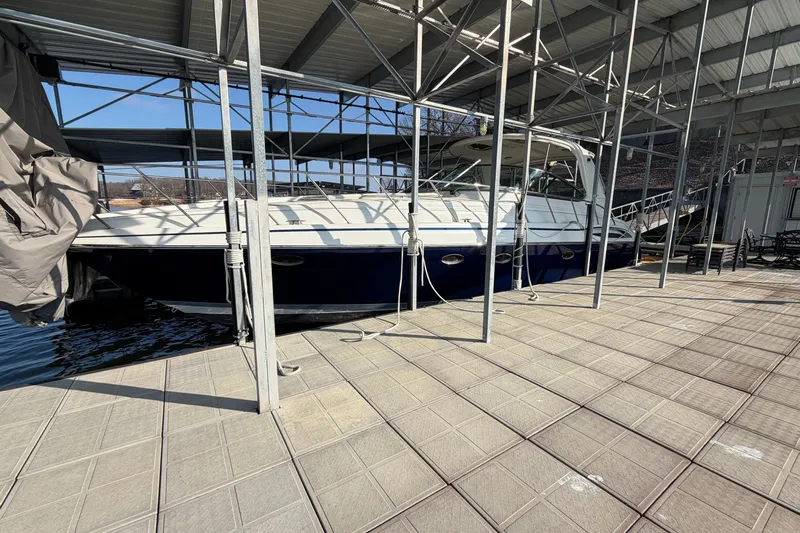  Yacht Photos Pics 2005 Formula 48 Yacht docked under a covered marina, side view.