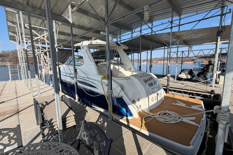  Yacht Photos Pics 2005 Formula 48 Yacht docked under a covered marina on a sunny day.