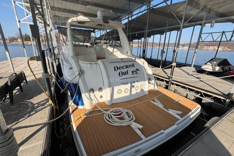  Yacht Photos Pics 2005 Formula 48 Yacht docked, featuring spacious deck and covered marina setting.