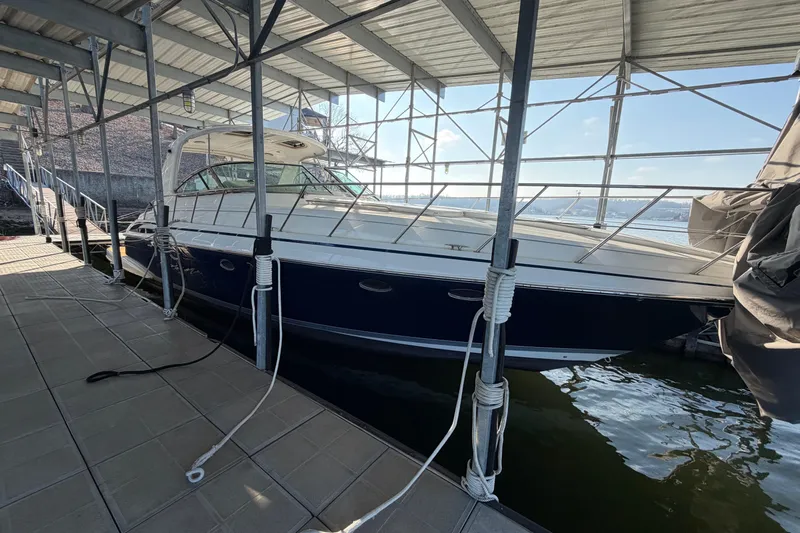  Yacht Photos Pics 2005 Formula 48 Yacht docked under a covered marina.