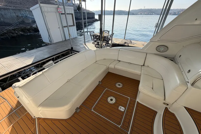  Yacht Photos Pics Luxurious seating area on 2005 Formula 48 Yacht with teak flooring, dockside view.