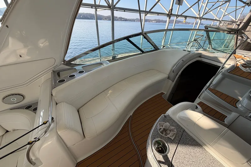  Yacht Photos Pics Luxurious interior of a 2005 Formula 48 Yacht with white seating and wooden flooring.