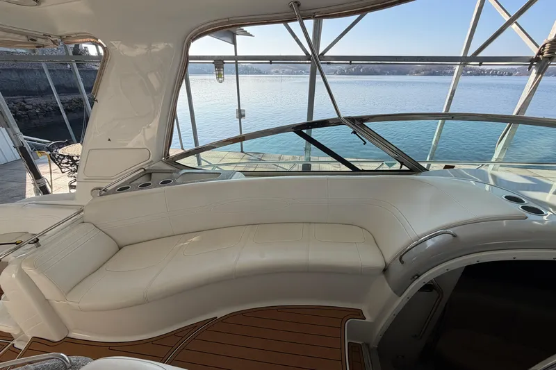  Yacht Photos Pics Luxurious interior of a 2005 Formula 48 Yacht with white seating and scenic water view.