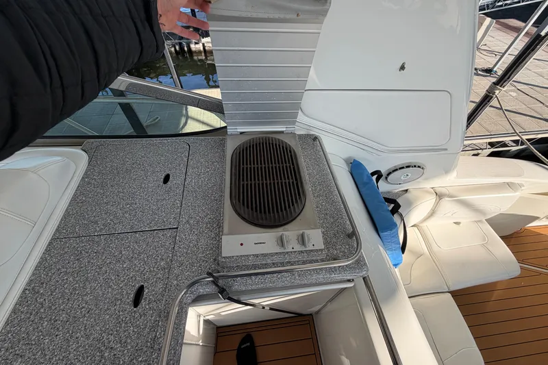  Yacht Photos Pics Outdoor kitchen area on a 2005 Formula 48 Yacht with grill and seating.