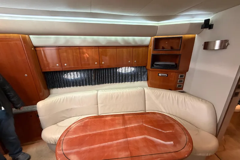  Yacht Photos Pics Luxurious interior of 2005 Formula 48 Yacht with leather seating and wooden cabinetry.