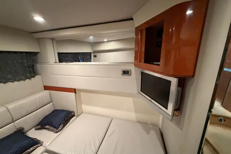  Yacht Photos Pics Interior of 2005 Formula 48 Yacht with TV, seating, and modern decor.