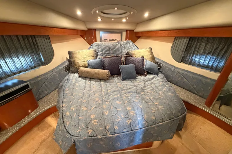 Yacht Photos Pics Luxurious bedroom interior of 2005 Formula 48 Yacht with elegant bedding and ambient lighting.