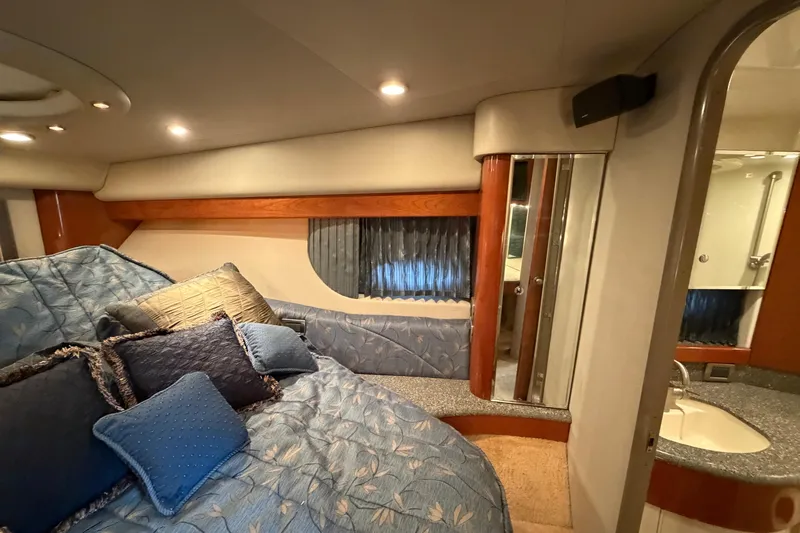  Yacht Photos Pics Luxurious 2005 Formula 48 Yacht cabin with plush bedding and elegant decor.