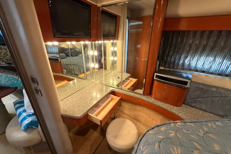 Yacht Photos Pics Luxurious interior of a 2005 Formula 48 Yacht with vanity, mirrors, and elegant wood finishes.