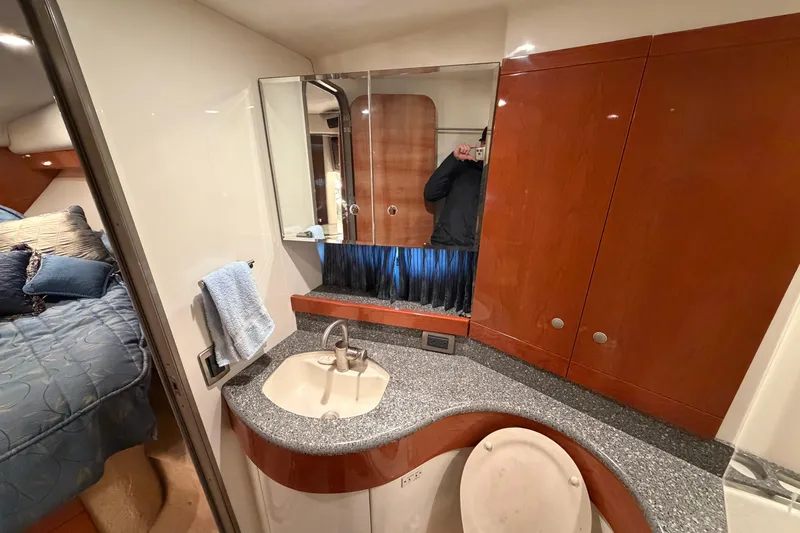  Yacht Photos Pics Luxurious bathroom interior of 2005 Formula 48 Yacht with modern sink and wooden cabinetry.
