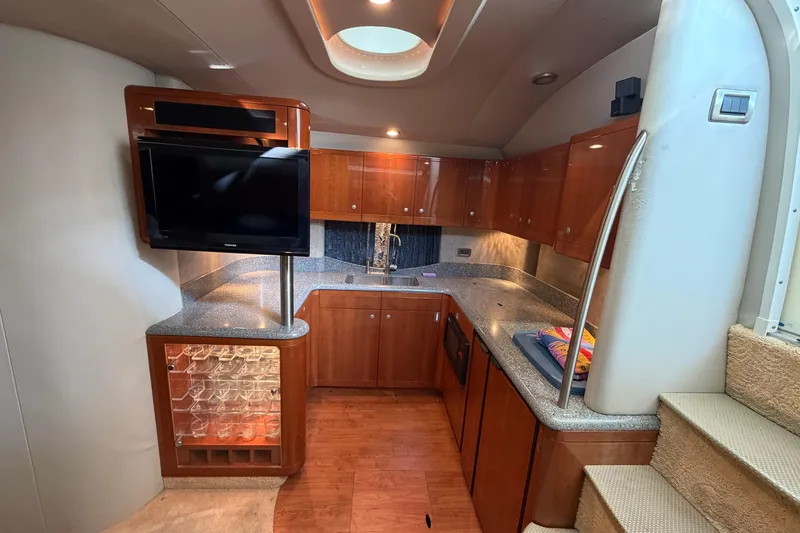  Yacht Photos Pics Interior of 2005 Formula 48 Yacht with modern kitchen and entertainment area.