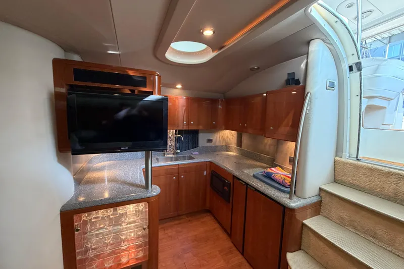  Yacht Photos Pics Luxurious interior of a 2005 Formula 48 Yacht with modern kitchen and TV.
