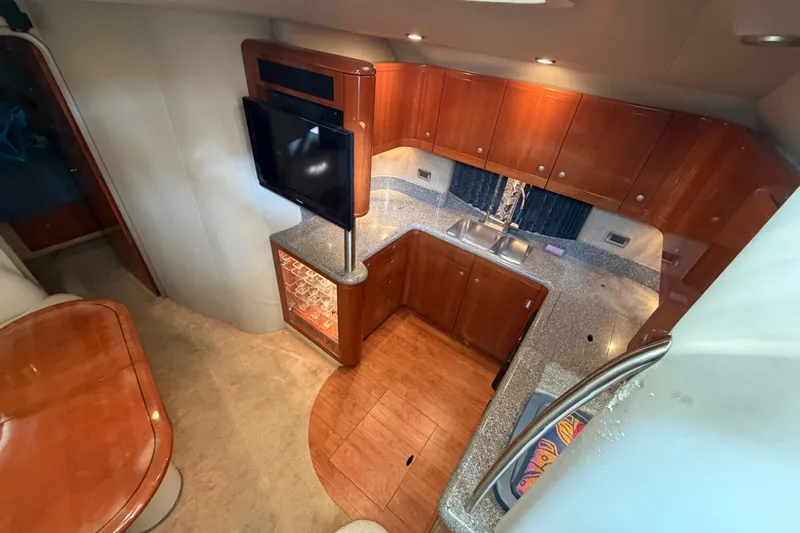  Yacht Photos Pics Luxurious interior of 2005 Formula 48 Yacht with modern kitchen and entertainment area.