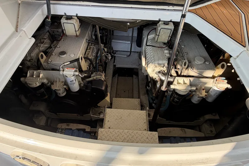  Yacht Photos Pics Engine compartment of a 2005 Formula 48 Yacht, showcasing dual engines and mechanical components.