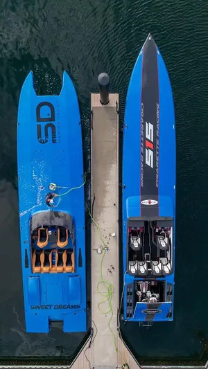  Yacht Photos Pics Overhead view of two blue Skater boats docked, model 46, year 2013.