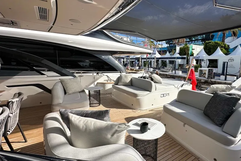  Yacht Photos Pics Luxurious 2025 Princess S80 yacht deck with elegant seating and modern design.
