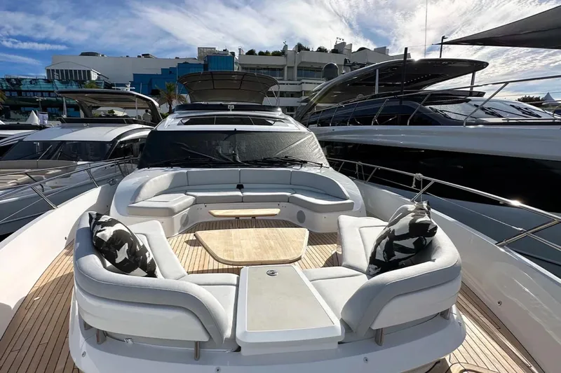  Yacht Photos Pics Luxurious 2025 Princess S80 yacht with elegant outdoor seating and modern design.
