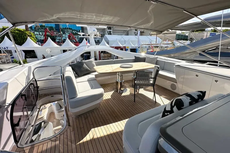  Yacht Photos Pics Luxurious 2025 Princess S80 yacht deck with elegant seating and modern design.