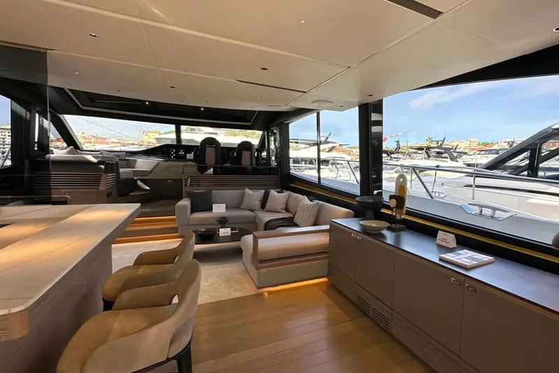  Yacht Photos Pics Luxurious interior of 2025 Princess S80 yacht with modern furnishings and panoramic windows.