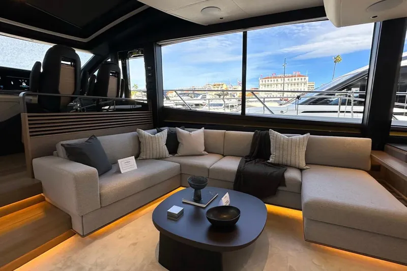  Yacht Photos Pics Luxurious interior of 2025 Princess S80 yacht with modern seating and large windows.