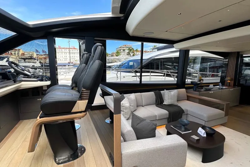  Yacht Photos Pics Luxurious interior of 2025 Princess S80 yacht with modern seating and panoramic windows.