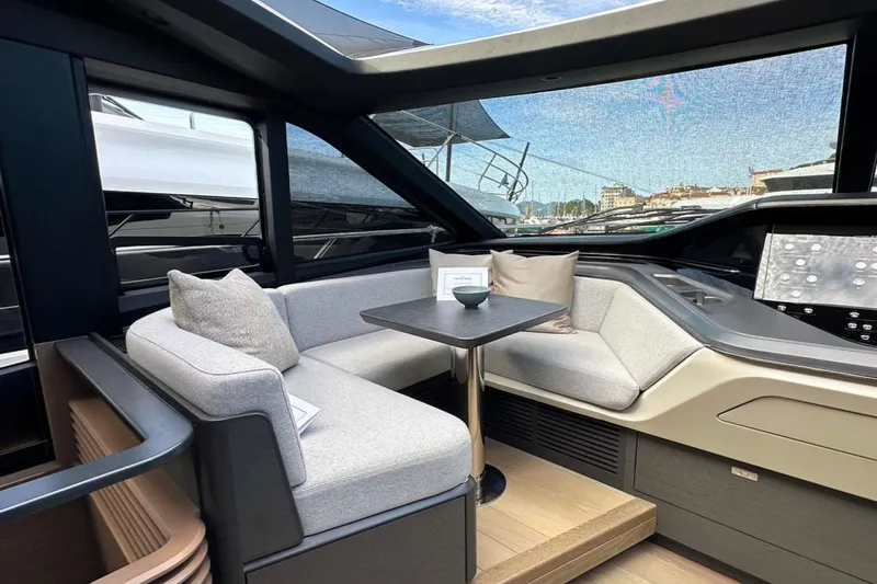  Yacht Photos Pics Luxurious interior of 2025 Princess S80 yacht with modern seating and sleek design.