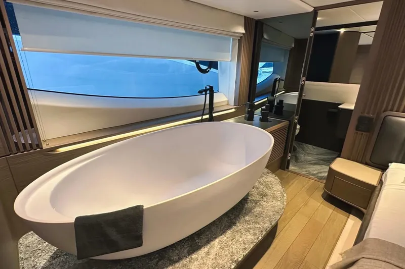  Yacht Photos Pics Luxurious bathroom with freestanding tub in 2025 Princess S80 yacht.