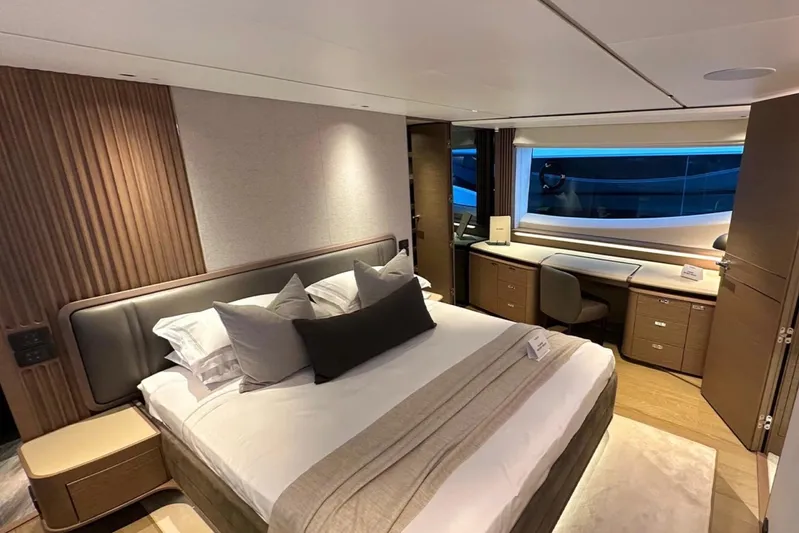  Yacht Photos Pics Luxurious bedroom interior of 2025 Princess S80 yacht with modern design and elegant furnishings.
