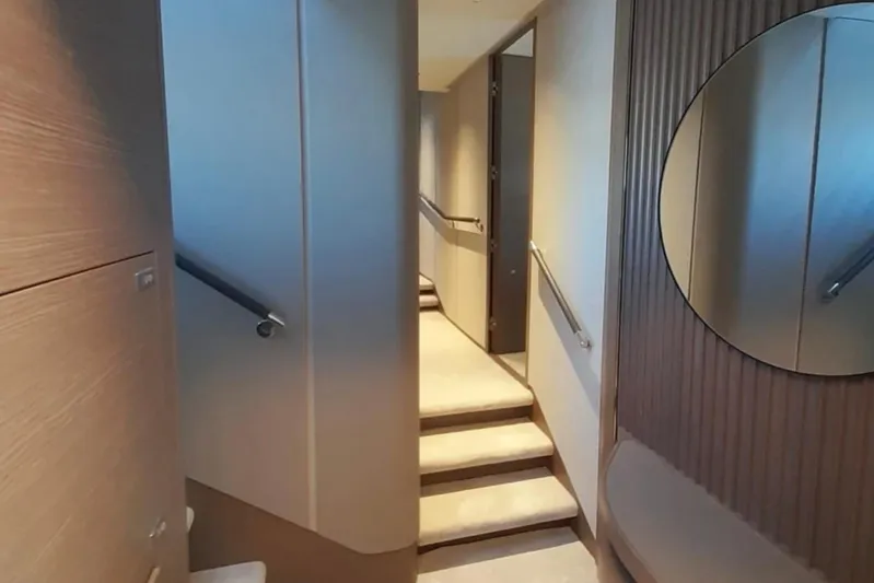  Yacht Photos Pics Interior of 2025 Princess S80 yacht, featuring modern design and elegant staircase.