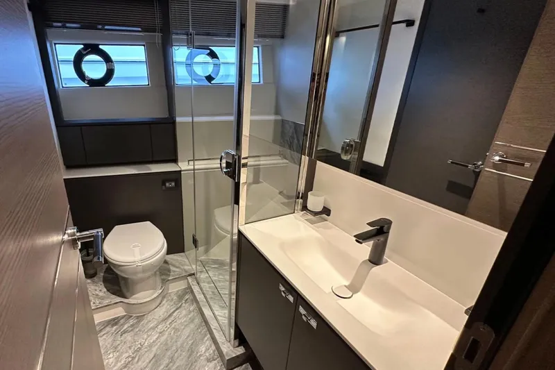  Yacht Photos Pics Luxurious bathroom in 2025 Princess S80 yacht with modern fixtures and elegant design.