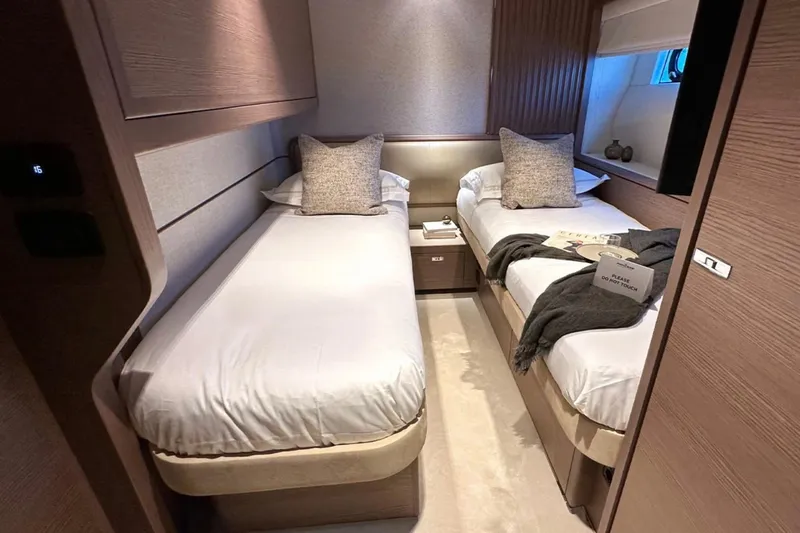  Yacht Photos Pics Luxurious twin cabin in 2025 Princess S80 yacht, featuring elegant bedding and modern decor.