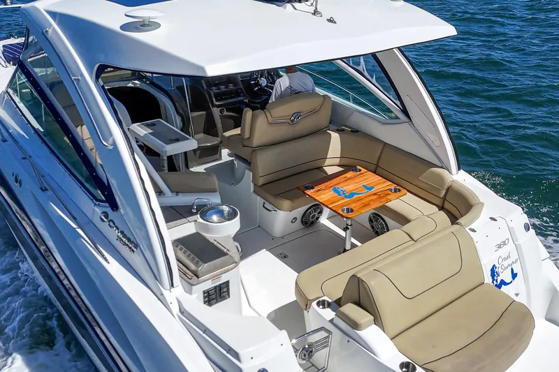 Cruel Summer Yacht Photos Pics 2012 Cruisers 380 Express yacht with spacious seating and elegant design on open water.