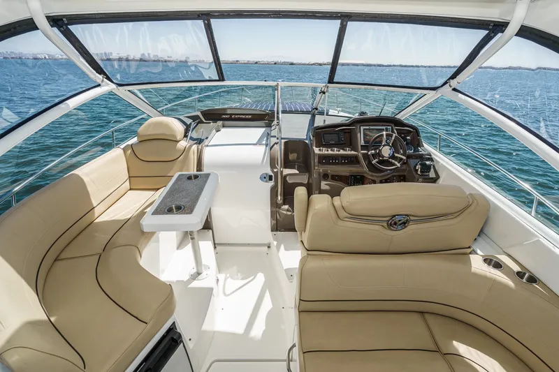 Cruel Summer Yacht Photos Pics Luxurious 2012 Cruisers 380 Express yacht interior with beige seating and ocean view.
