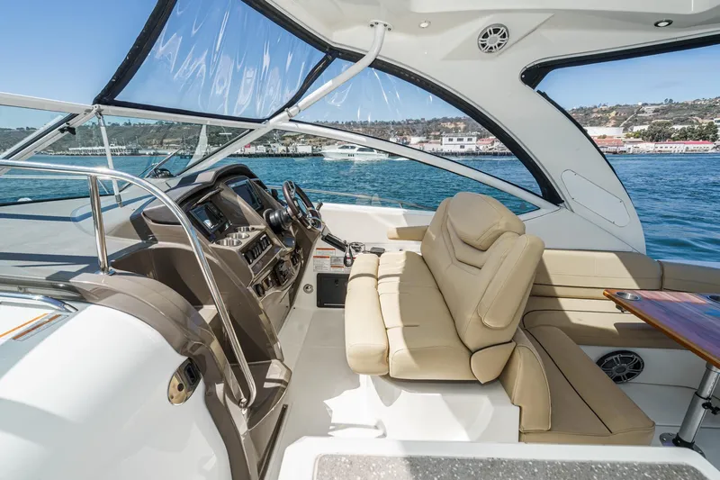 Cruel Summer Yacht Photos Pics 2012 Cruisers 380 Express yacht interior with beige seating and modern dashboard.