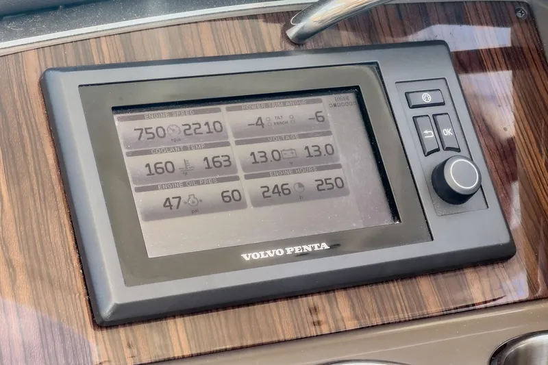 Cruel Summer Yacht Photos Pics Volvo Penta engine display on 2012 Cruisers 380 Express dashboard, showing various engine metrics.