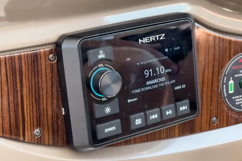 Cruel Summer Yacht Photos Pics Hertz audio system on 2012 Cruisers 380 Express boat dashboard, featuring FM radio display.