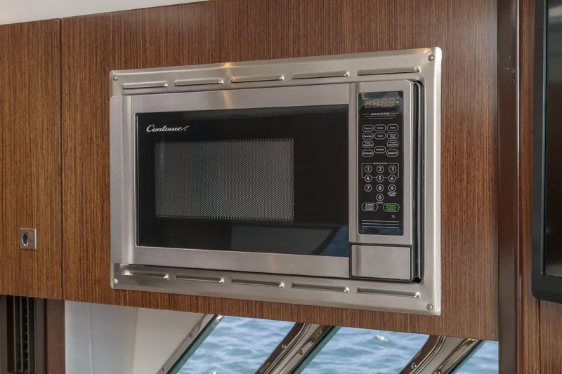 Cruel Summer Yacht Photos Pics Built-in microwave in 2012 Cruisers 380 Express yacht kitchen.