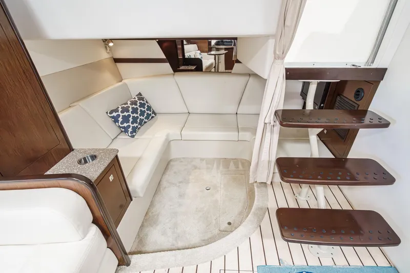 Cruel Summer Yacht Photos Pics Luxurious interior of 2012 Cruisers 380 Express yacht with elegant seating and wooden accents.