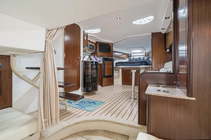 Cruel Summer Yacht Photos Pics Luxurious interior of 2012 Cruisers 380 Express yacht with modern amenities and wood finishes.