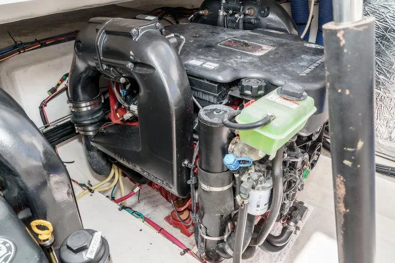 Cruel Summer Yacht Photos Pics Engine compartment of a 2012 Cruisers 380 Express boat, showcasing detailed components.