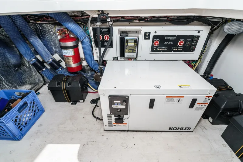 Cruel Summer Yacht Photos Pics Engine room of 2012 Cruisers 380 Express with Kohler generator and control panel.
