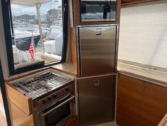 Seahorse Yacht Photos Pics Interior of 2019 Ranger Tugs R-41 CB yacht kitchen with stove and stainless steel appliances.