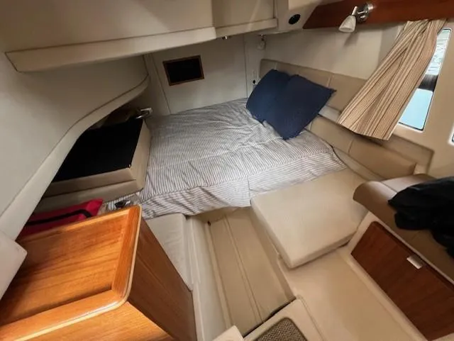 Seahorse Yacht Photos Pics 2019 Ranger Tugs R-41 CB cabin interior with cozy bedding and wooden accents.