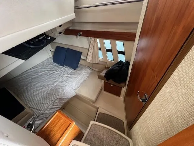 Seahorse Yacht Photos Pics Interior cabin of 2019 Ranger Tugs R-41 CB with bed and wooden accents.