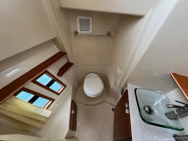 Seahorse Yacht Photos Pics 2019 Ranger Tugs R-41 CB bathroom with toilet, sink, and window.