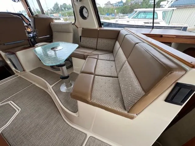 Seahorse Yacht Photos Pics Interior of 2019 Ranger Tugs R-41 CB with plush seating and glass table.