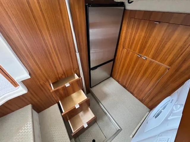 Seahorse Yacht Photos Pics Interior of 2019 Ranger Tugs R-41 CB with wooden cabinetry and compact stairs.