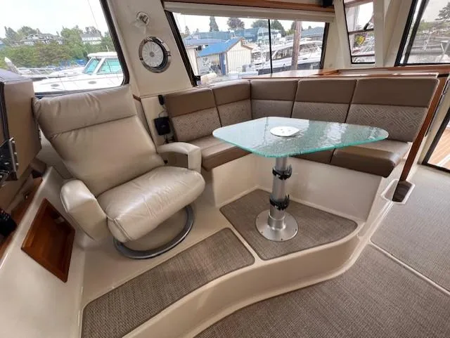 Seahorse Yacht Photos Pics 2019 Ranger Tugs R-41 CB interior with leather seating and glass table.