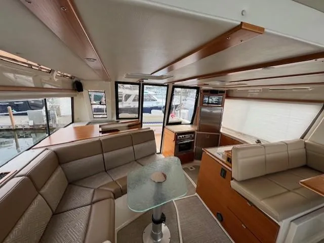 Seahorse Yacht Photos Pics Interior of 2019 Ranger Tugs R-41 CB, featuring modern seating and a glass table.