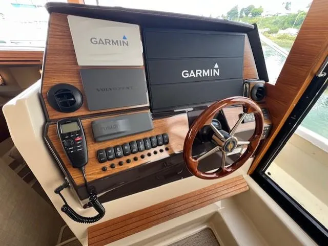 Seahorse Yacht Photos Pics 2019 Ranger Tugs R-41 CB helm with Garmin navigation system and wooden steering wheel.